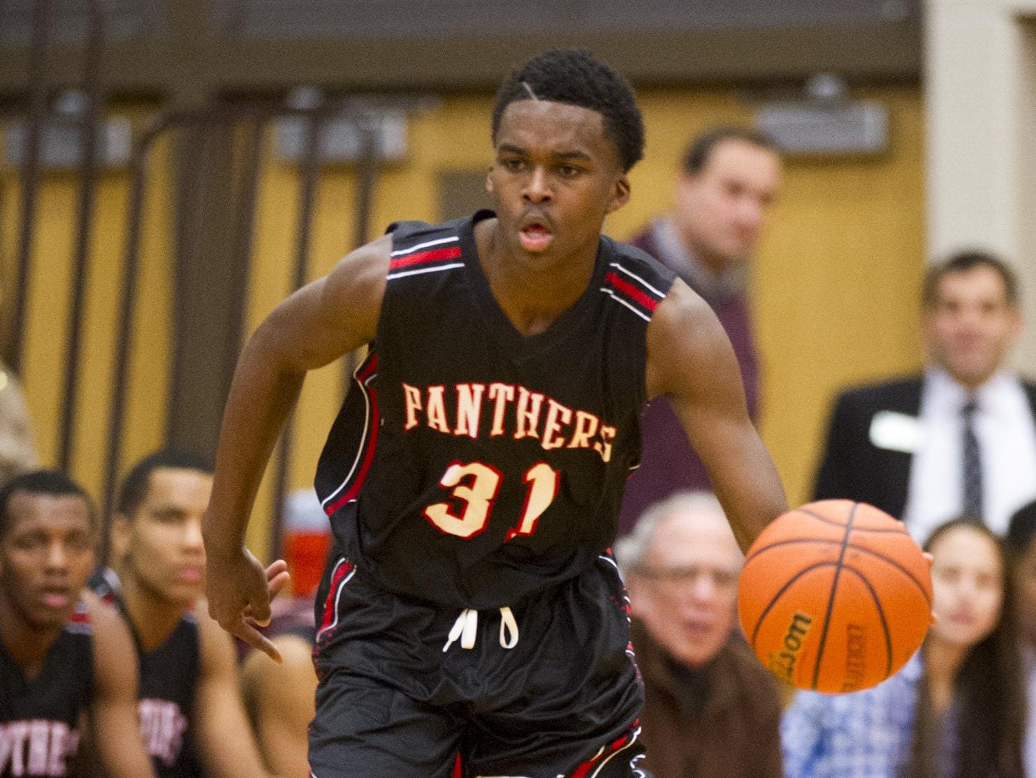 North Central’s Kris Wilkes brings the ball upcourt Jan. 13 at the county tourney.