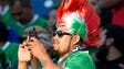 A fan records the scene at the Mexico-New Zealand soccer