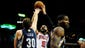 Chicago Bulls power forward Carlos Boozer (5) puts up a shot as Memphis Grizzlies power forward Jon Leuer (30) defends during the first quarter at Scottrade Center.