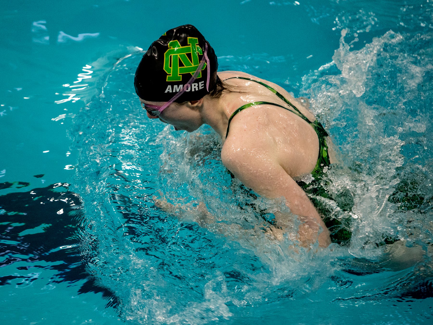 Newark Catholic’s Rose Amore swims the breaststroke in the 200 medley relay Saturday during the Division II sectional meet at Columbus Academy.