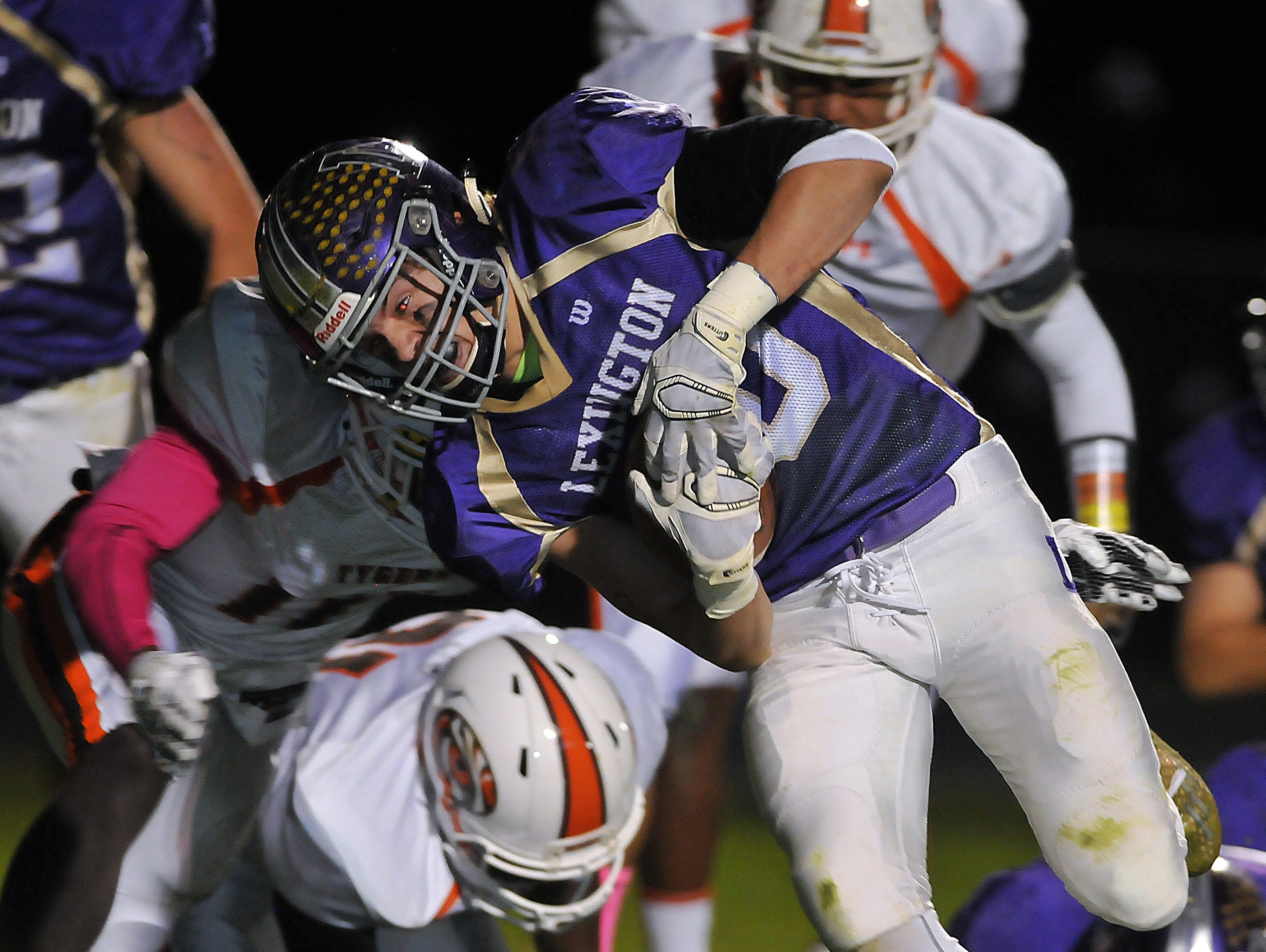 Lexington's Hunter Biddle dives for the end zone during their game Friday night against Mansfield Senior.