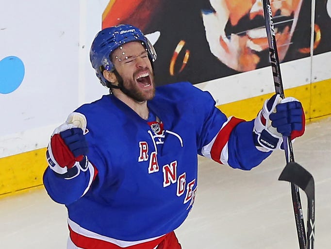Rangers center Dominic Moore (celebrates after scoring
