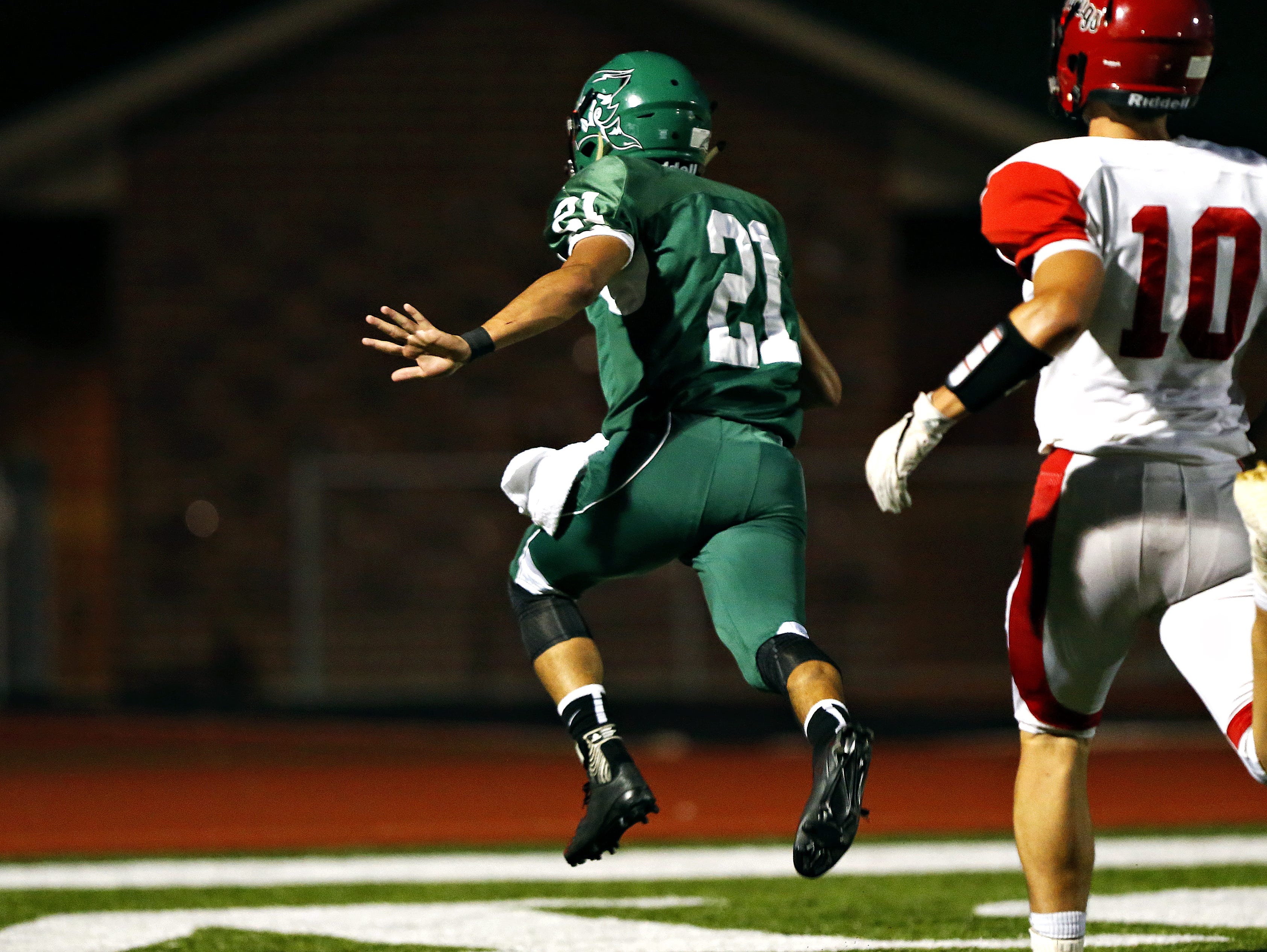 Mt. Vernon running back Andrew Montemayor (21) leaps into the end zone for a touchdown. Montemayor is a first team all-Big 8 Conference wide receiver.