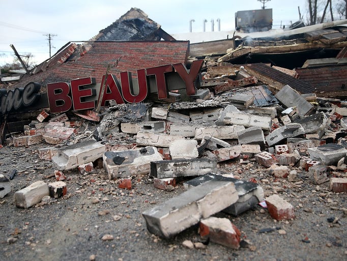DELLWOOD, MO - NOVEMBER 25:  A sign sits amidst rubble
