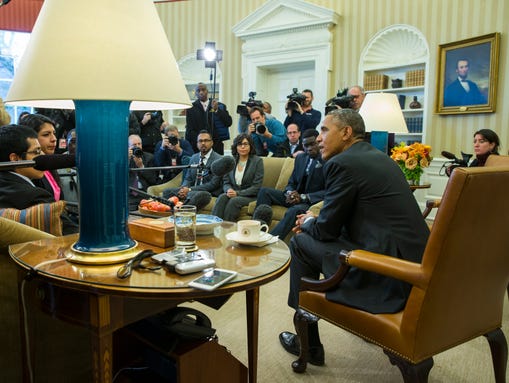 President Obama meets with a group in the Oval Office