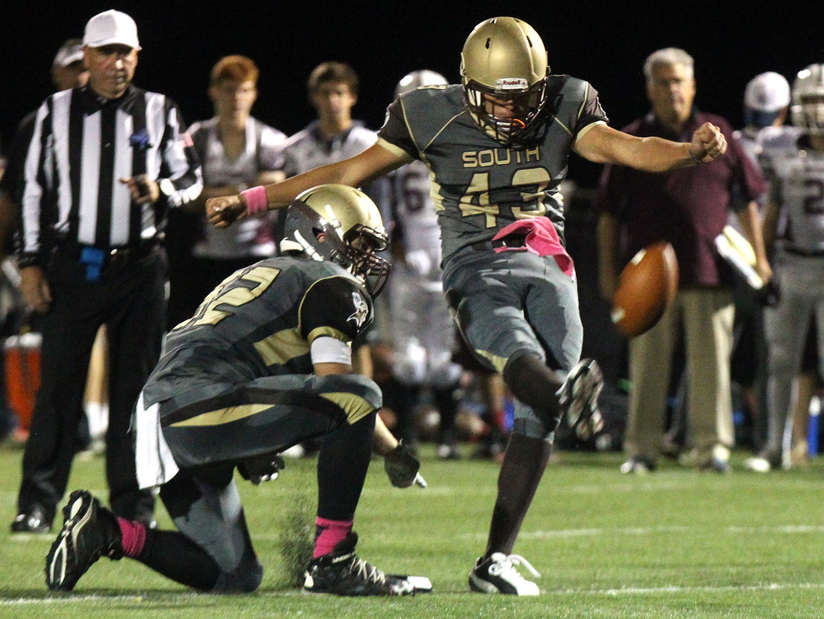 Clarkstown South's Michael Tagaris kicks a field goal during Friday night's game against Scarsdale at Clarkstown South.