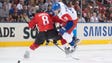 Team Canada defenseman Drew Doughty (8) battles for