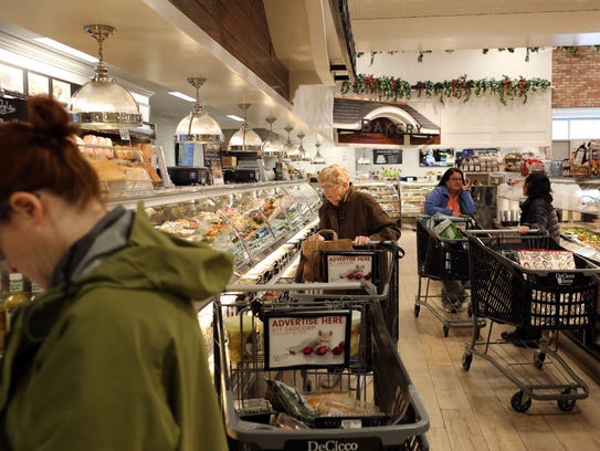 Customers in the deli and prepared food section of