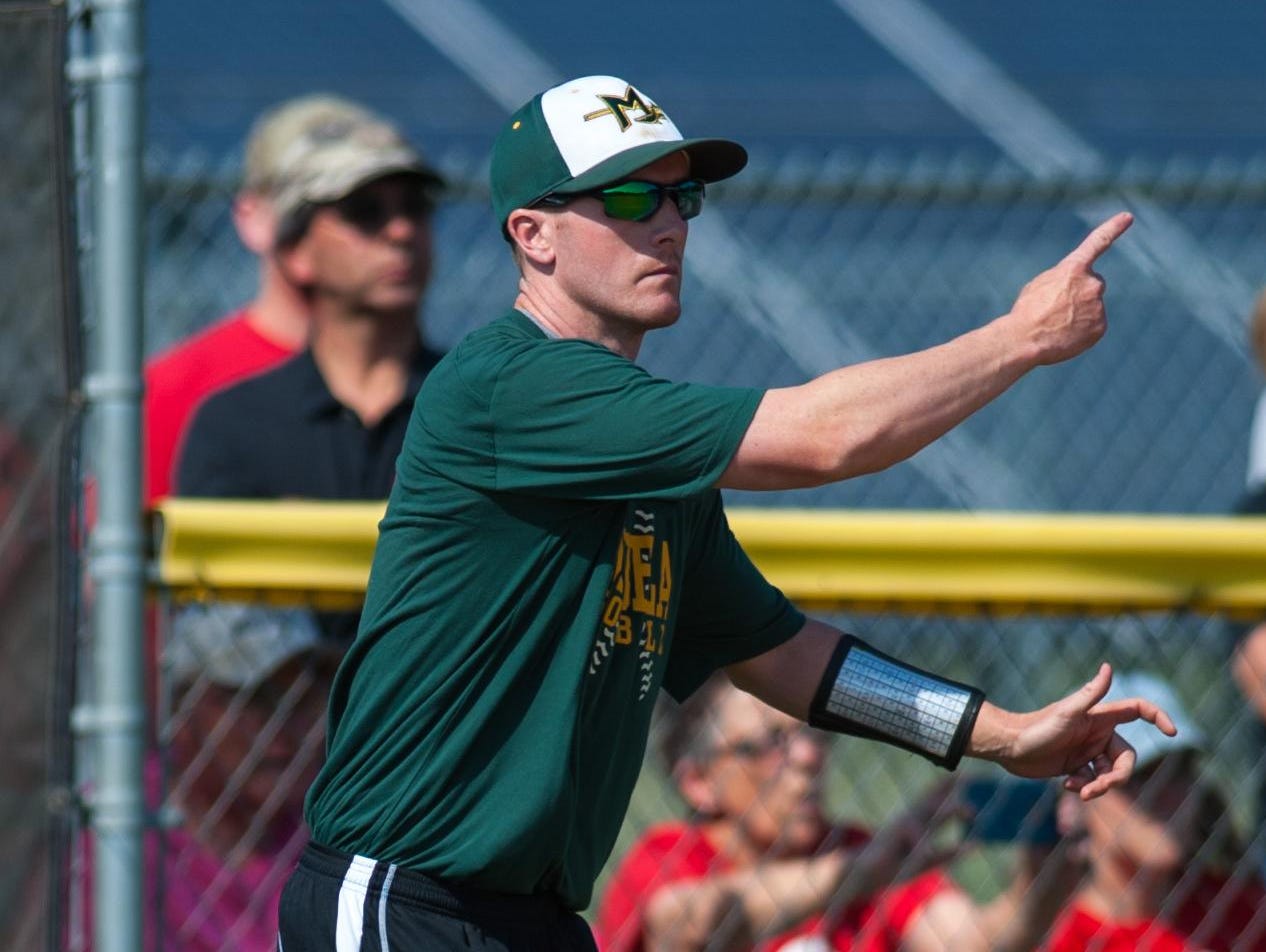 Mardela head coach Korey Shiles waves in a runner against Colonel Richardson in the MPSSAA 1A East Softball Region Finals in Federalsburg. Shiles won the Bayside South Coach of the Year honor for the seventh time.