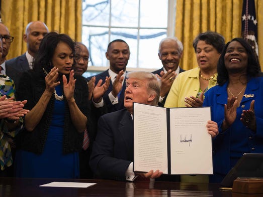 Trump holds up an executive order to bolster historically
