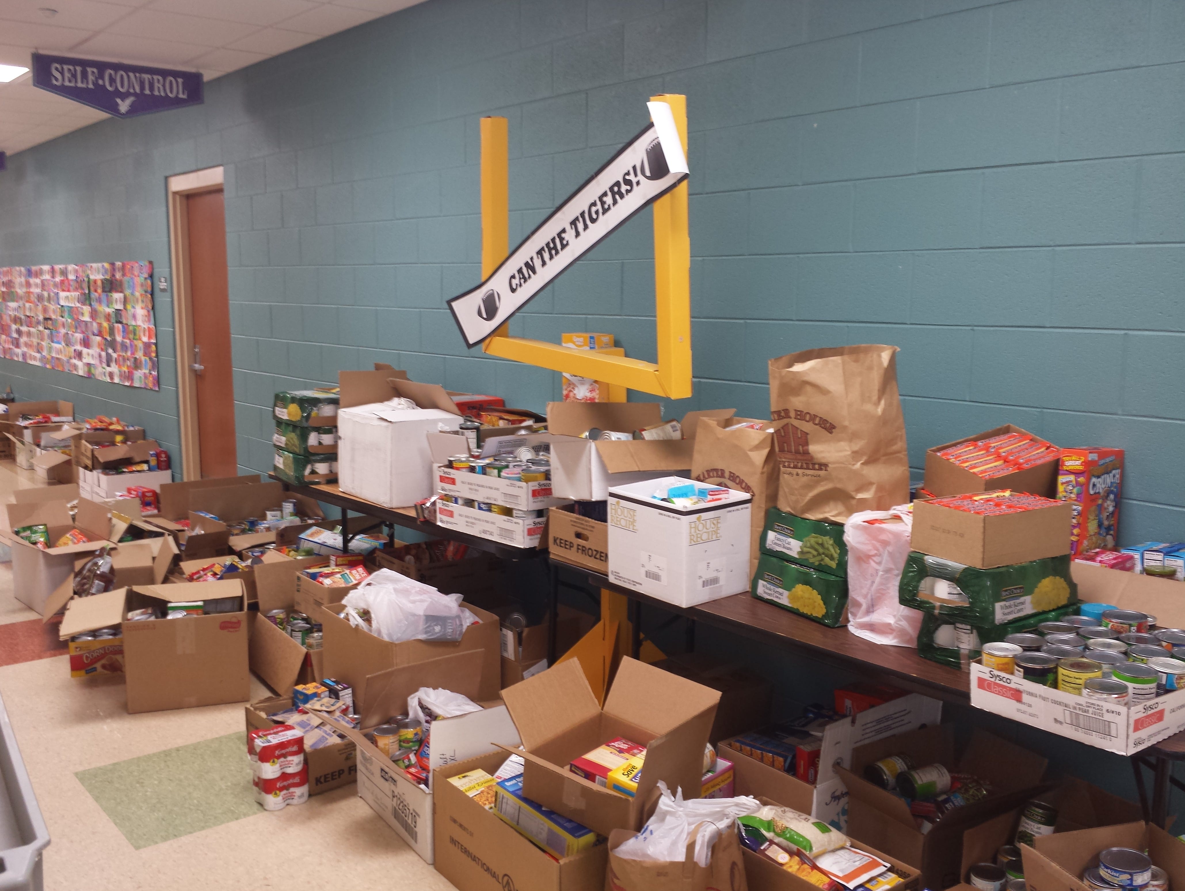 The ninth annual Can the Tigers, Can the Eagles food drive competition generated almost two months of worth of food for Least of These.