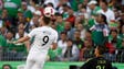 New Zealand's Chris Wood (9) heads the ball defended