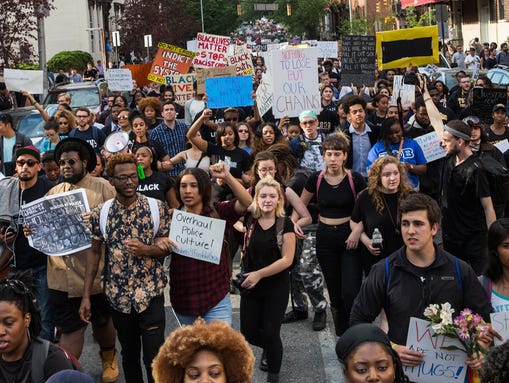Protesters march chanting 'Justice for Freddie Gray'