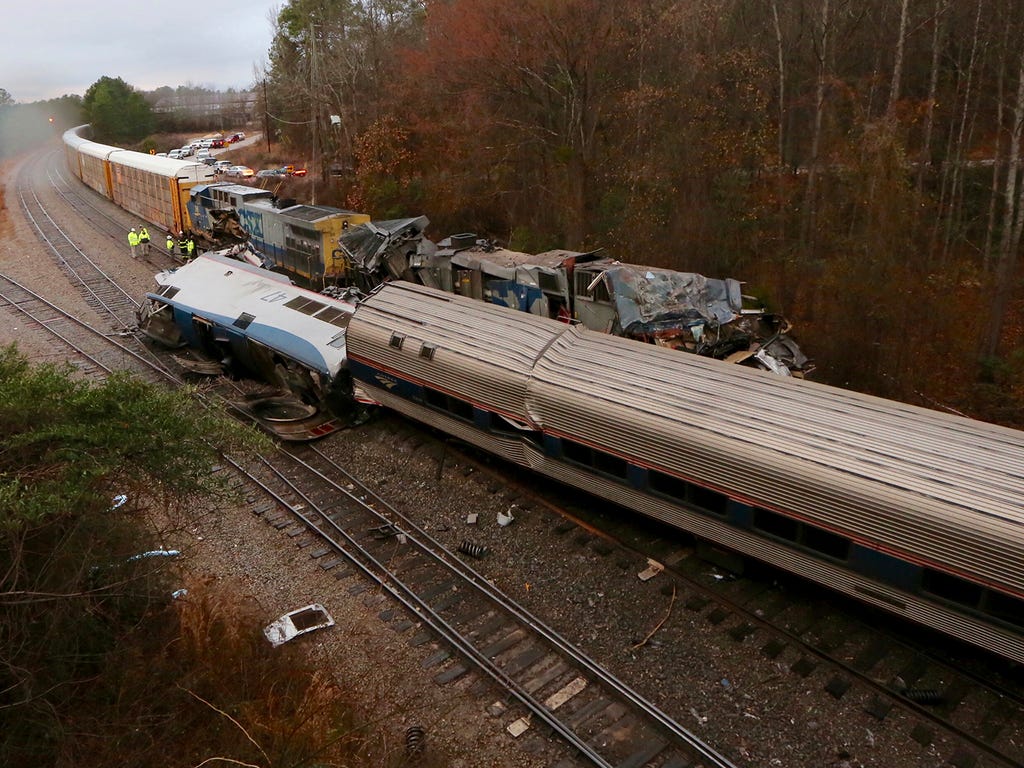 Authorities investigate the scene of a fatal Amtrak train crash in Cayce, South Carolina, Sunday, Feb. 4, 2018. At least two people were killed and dozens injured when an Amtrak passenger train collided with a CSX freight train.