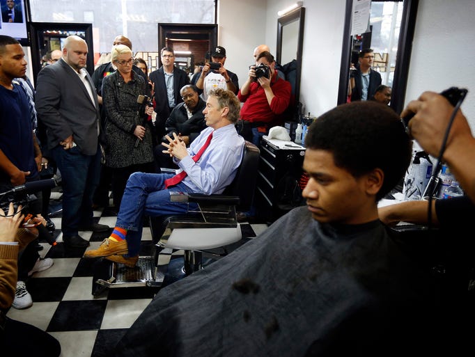 J.T. Kramer, 17, of Des Moines gets a haircut as Republican