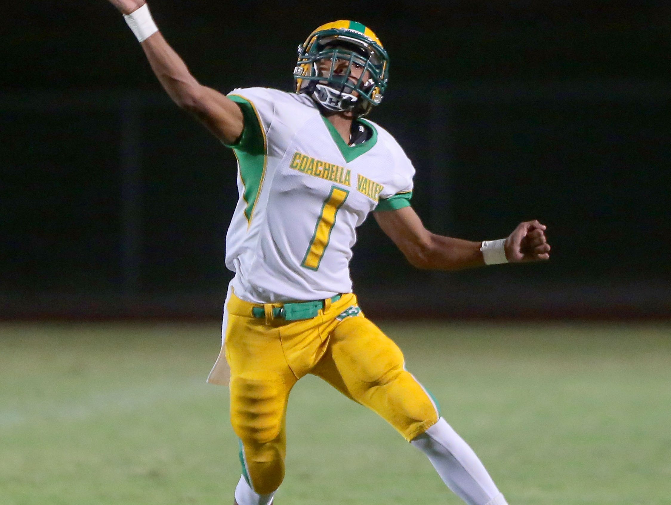 Coachella Valley quarterback Armando Deniz throws against Cathedral City, August 26, 2016.
