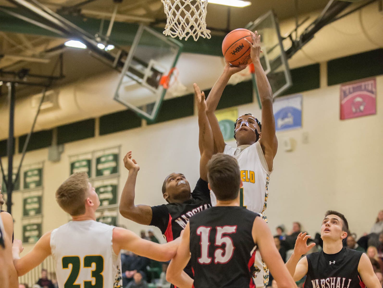 Pennfield's Francois Jamierson (11) goes for the hoop during Friday night's game.
