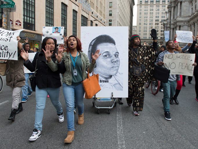 Protesters march around City Hall in Philadelphia and