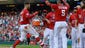 Harper celebrates with teammates after hitting a walk-off