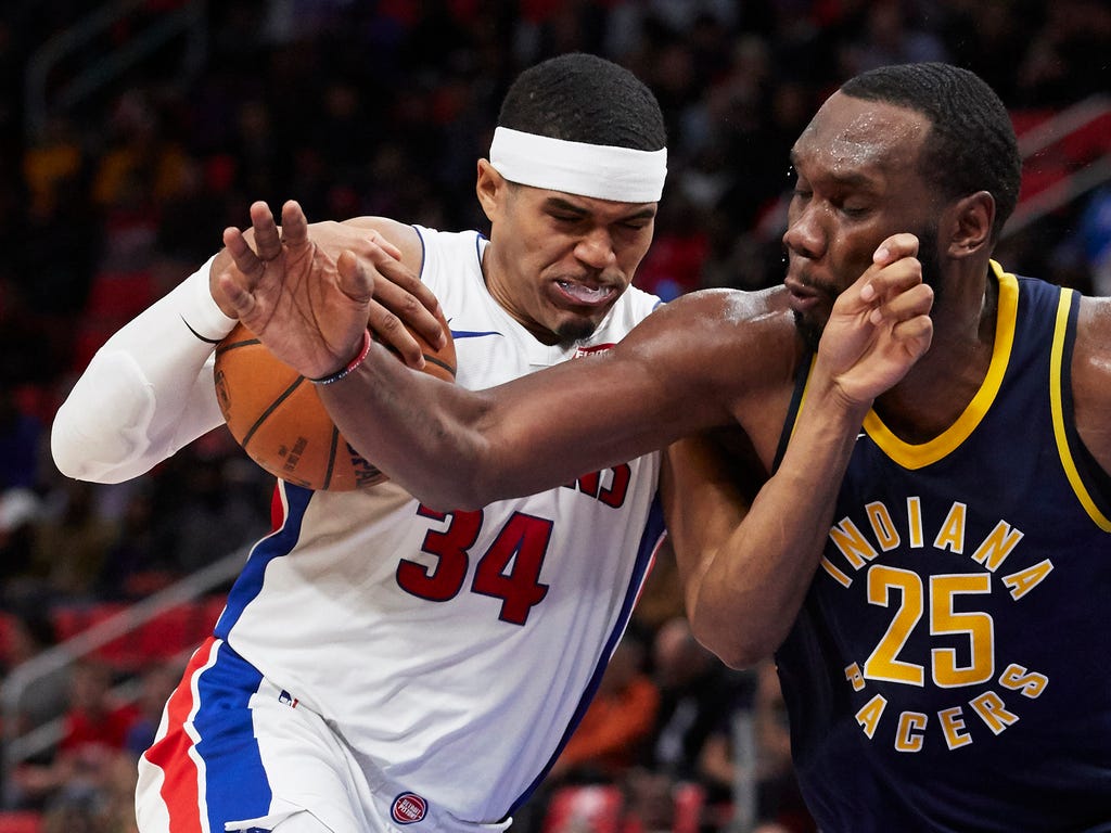Detroit Pistons forward Tobias Harris, left, drives to the basket against Indiana Pacers center Al Jefferson in the second half at Little Caesars Arena.
