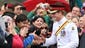 Prince Harry visits with members of the public outside