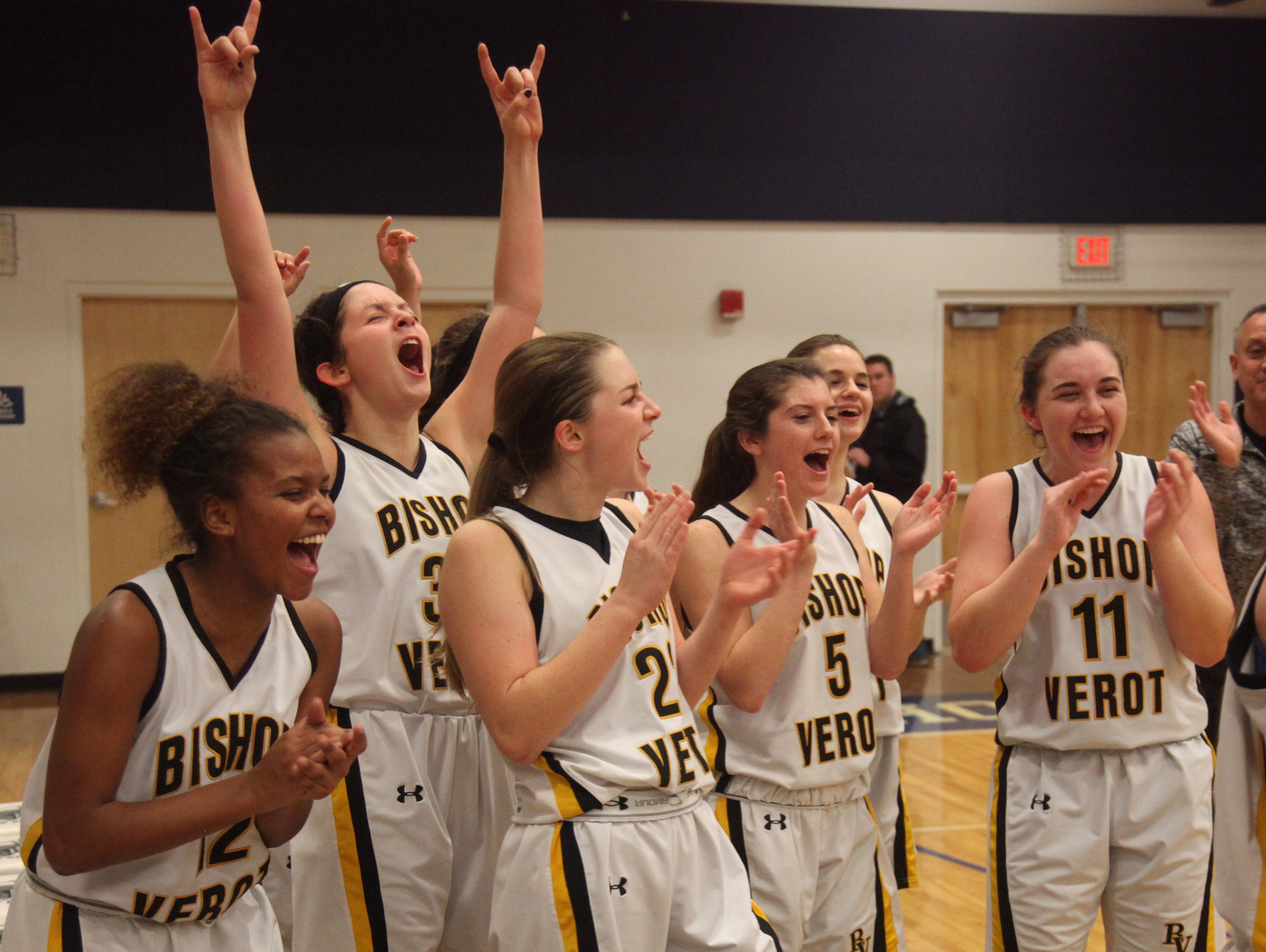 Members of the Bishop Verot High School girls basketball team celebrate after defeating Gateway Charter in the District 4A-10 finals on Thursday at Oasis High School.