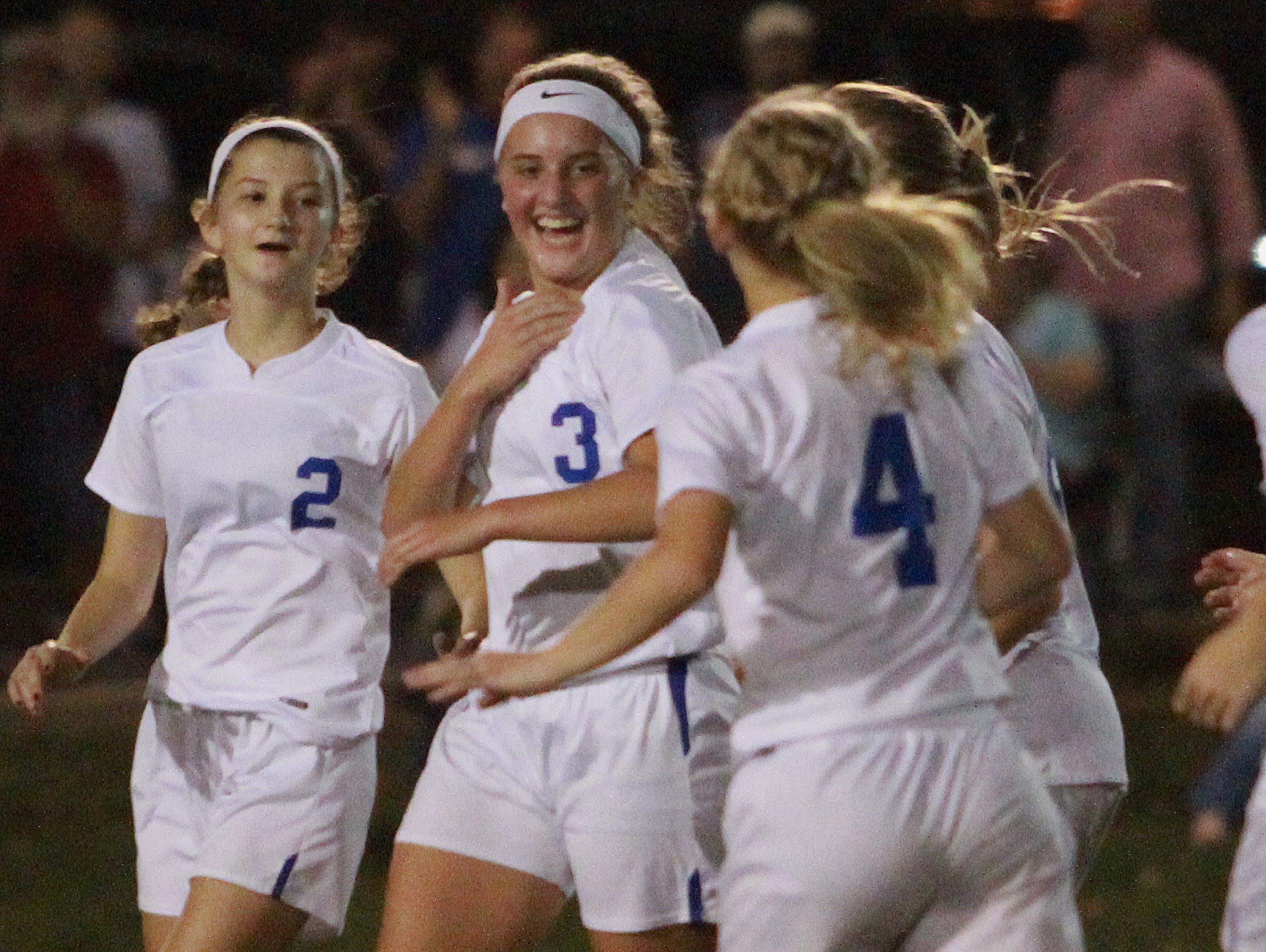 L-R White House's Shelby Deering, Mallory Humphries and Baylee Miller celebrate a goal against Hume-Fogg during Tuesday's Region 5 A-AA Tournament semifinal match.