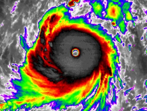 A color-enhanced satellite image shows Super Typhoon Soudelor spinning in the Pacific on Monday.