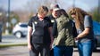 Women pray outside of the Leconte Center in Pigeon