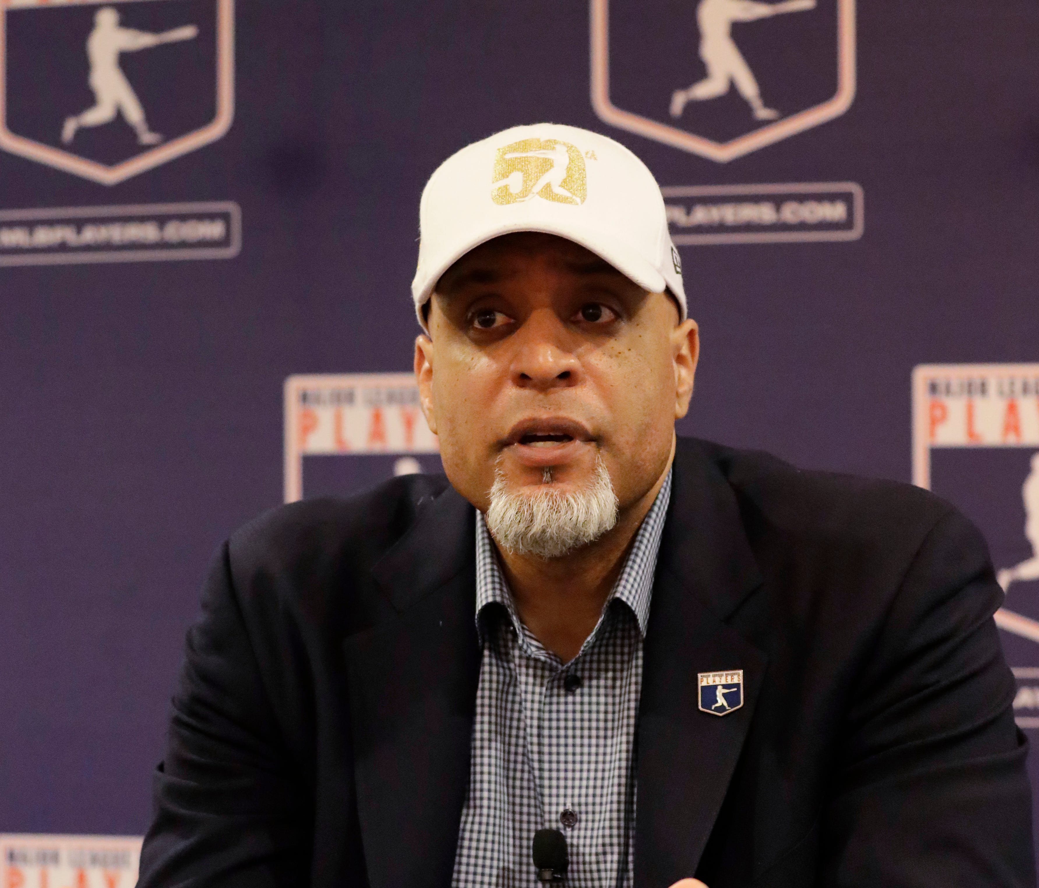 Executive director of the Major League Players Association Tony Clark answers questions at a news conference Sunday.