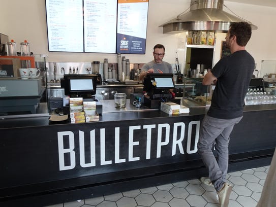 Patron waits for coffee at the Bulletproof Coffee location