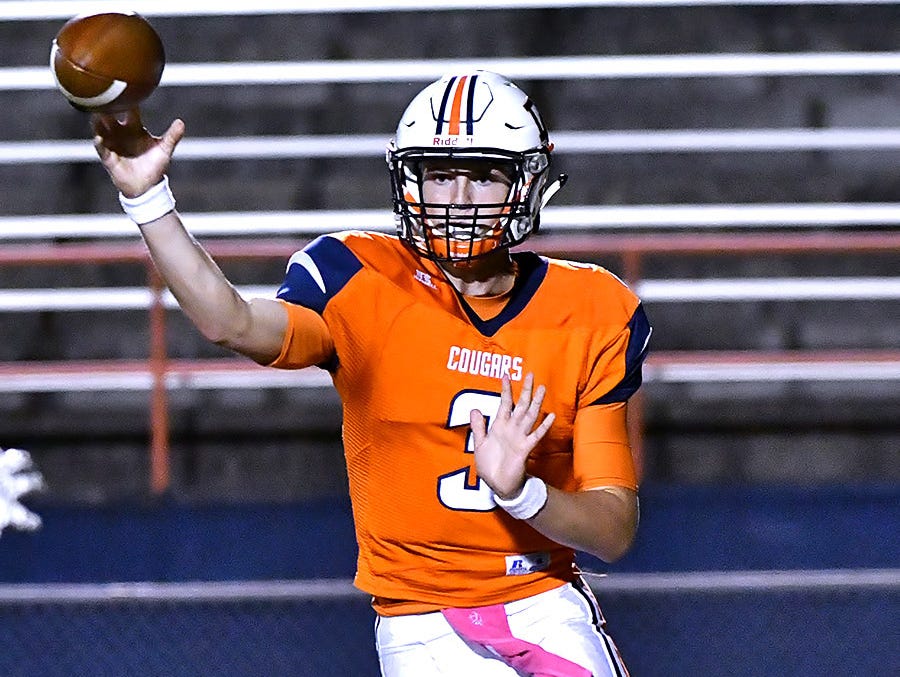 Dickson County quarterback Jacob Murphree completes a pass during the Cougars 38-28 win over Clarksville.