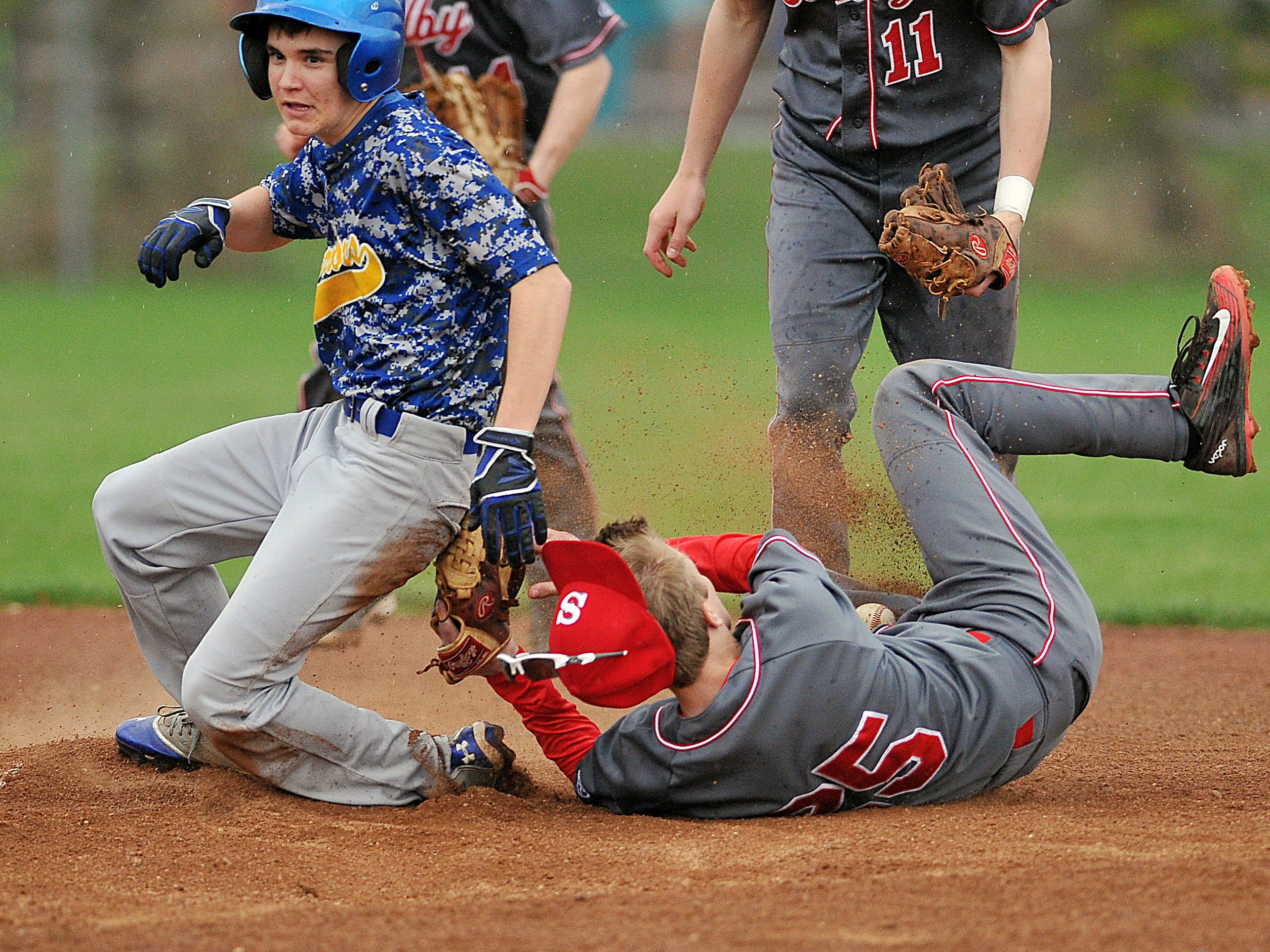 Players get tangled up at second base during a game Monday between Shelby and Ontario.
