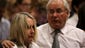 Reeva Steenkamp's mother is comforted by unidentified relative after her dead daughter's picture was shown on screen during trial on April 9.