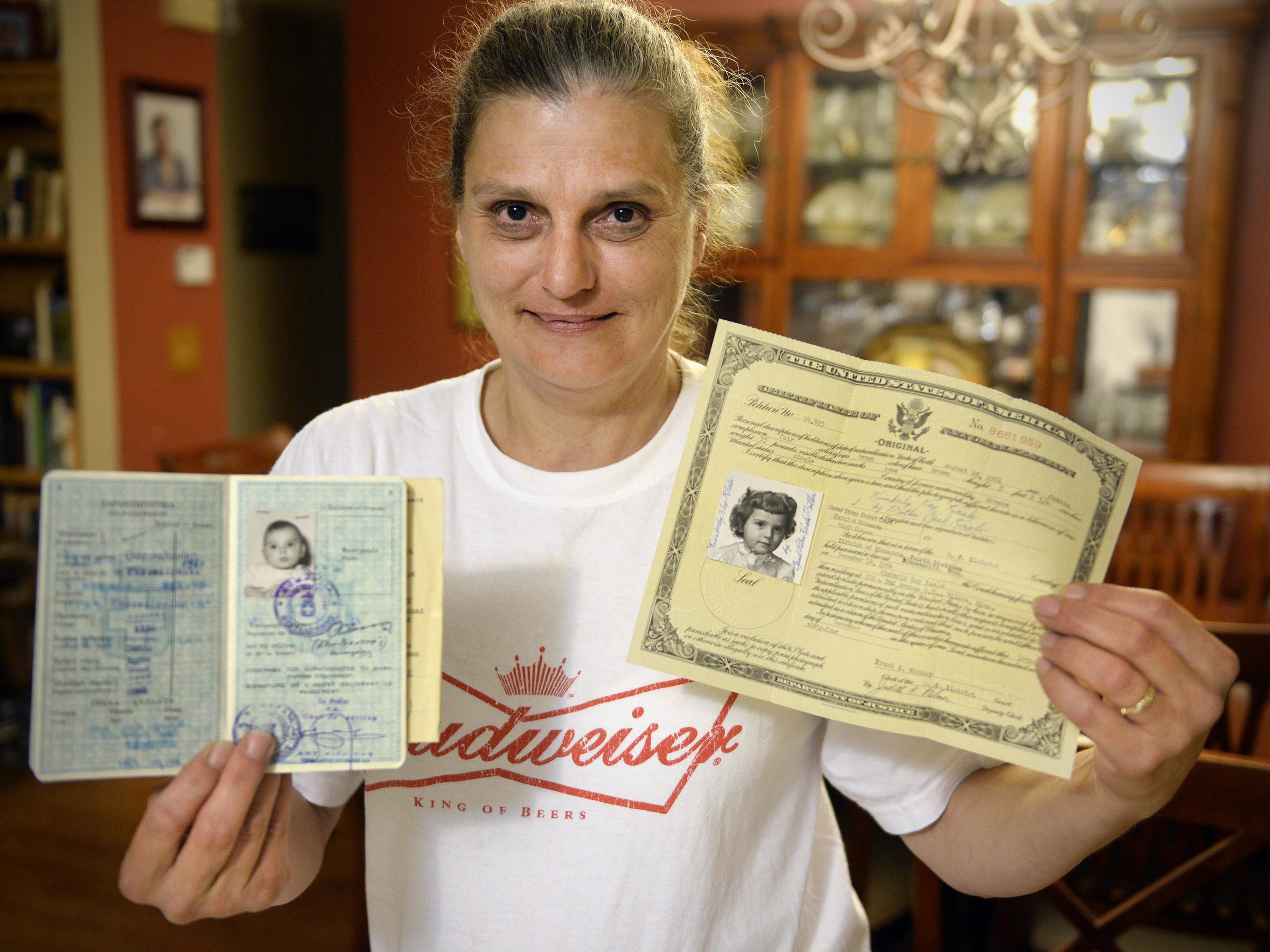 Kim Kruse has the documents adorned with her photo
