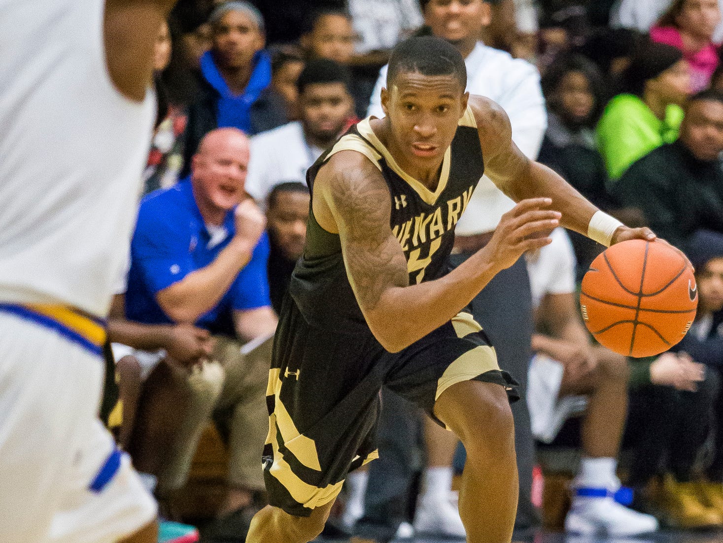 Newark's Michael Dumgo-Sharpe drives to the basket in the third quarter of Newark's 52-51 win over A.I. duPont High School in Greenville on Tuesday evening.