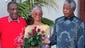 Cosby stands with his wife and Nelson Mandela in 1997.