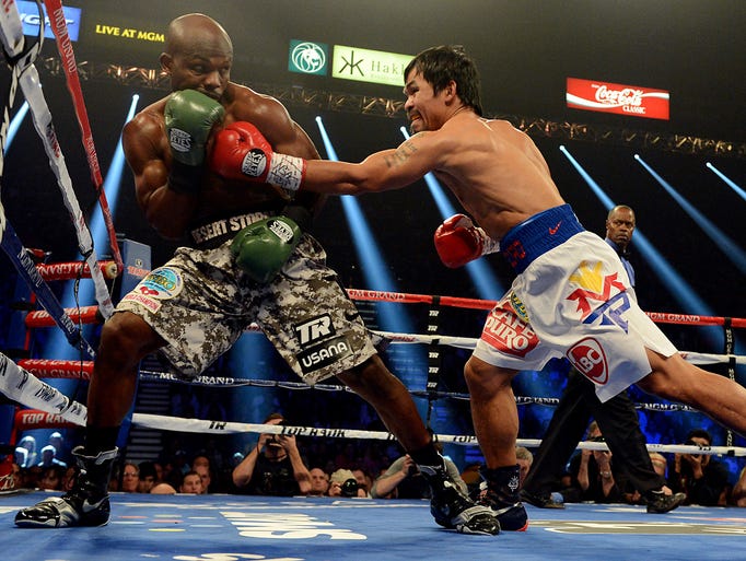 Timothy Bradley Jr. and Manny Pacquiao during their WBO World Welterweight Championship fight at MGM Grand Garden Arena.