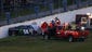 Medical staff and safety crews attend to Kyle Busch,