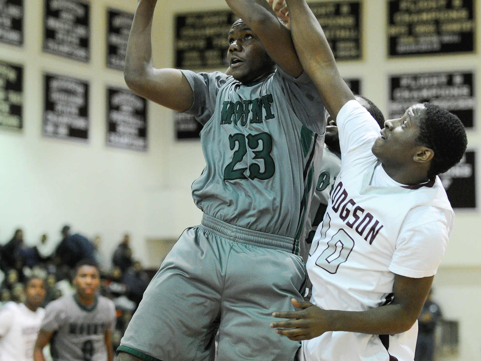 Mount Pleasant’s Ronald Shipman-Scott goes in for a layup as Hodgson’s Gregory Tucker tries to stop him.