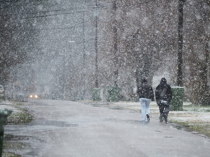 Spring storm brings more snow and ice