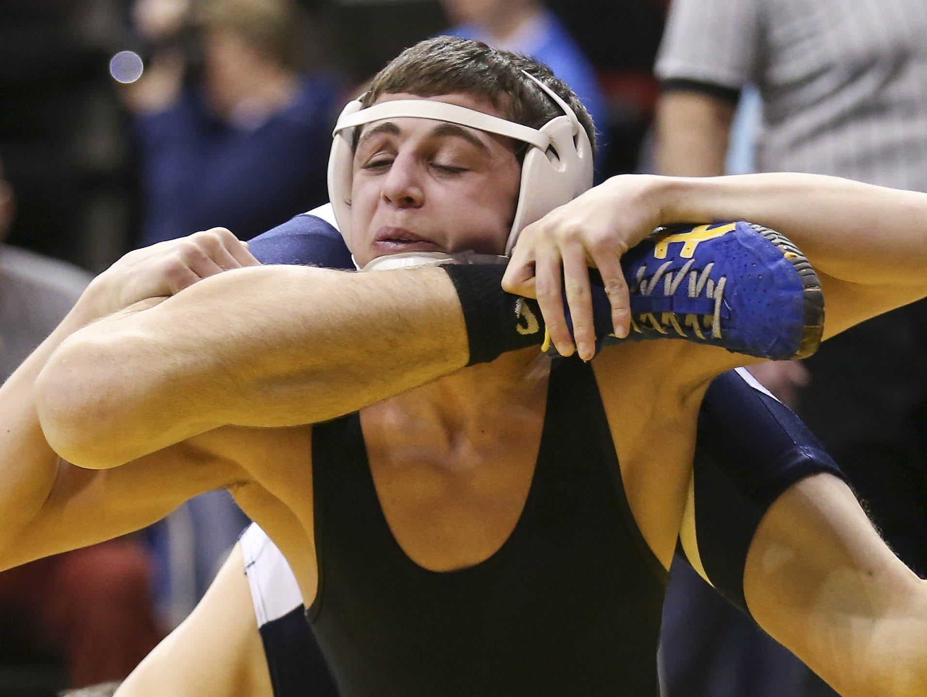 Adam Brown (Southeast Polk), top, controls Kyle Kuckta (Lewis Central) on Thursday.