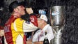 Clint Bowyer celebrates with a bottle of champagne and the championship trophy after winning the 2008 NASCAR Nationwide Series title.