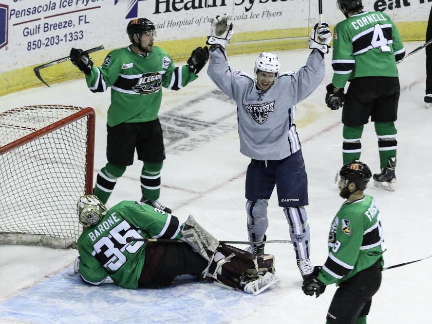 Ryan Kesti of the Ice Flyers reacts after beating IceGators goalie, Brad Barone, during Friday night's game at the Pensacola Bay Center.