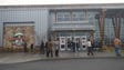 Evacuees stand outside of the Rocky Top Sports Center,