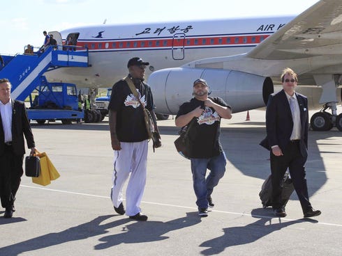 Former NBA star Dennis Rodman, third right,  arrives at Pyongyang airport, North Korea, earlier this month. The airline hopes to expand.