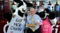 Dan T. Cathy, Chairman, President and CEO of Chick-fil-A with a couple of the company's famous  mascots at headquarters in Atlanta.