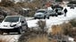 Cars slide across an icy Paseo del Norte in Albuquerque.