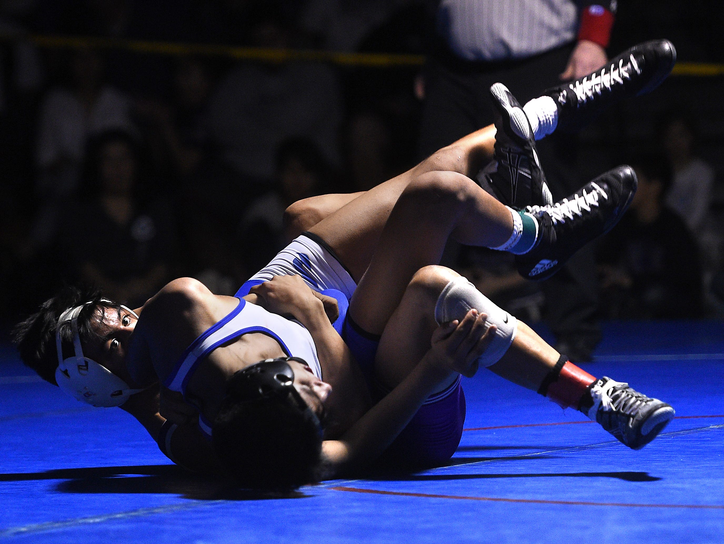 Spanish Springs' Jacob Ruiz, left, defeats Reed's Alex Casarez to win the 120-pound division during the 4A Northern Region Wrestling championships at Reno High School on Saturday.