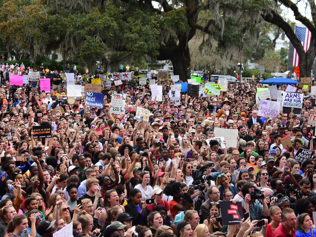 Protesters gather outside of the Florida Capitol on Feb. 21, 2018, to support the students of Marjory Stoneman Douglas High School. The students arrived in Tallahassee on Tuesday to push for laws to curb gun violence.
